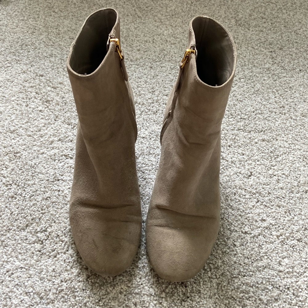 Tory Burch zip up boots.